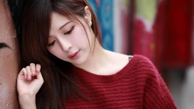 Julie chang in a red sweater 4k wallpaper