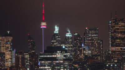 Night city tower glow 4k wallpaper