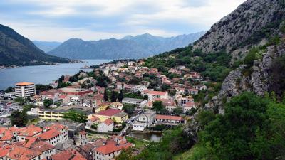 City roofs mountains 4k wallpaper