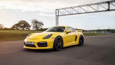 Porsche cayman gt4 yellow side view 4k wallpaper