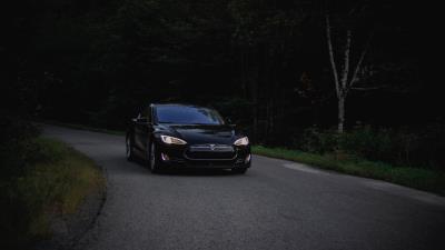 Tesla car asphalt 4k wallpaper
