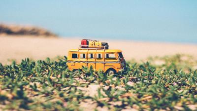 Bus toy grass 4k wallpaper