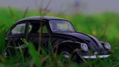 Car retro typewriter toy grass 4k wallpaper