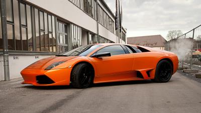 Lamborghini murcielago lp640 orange side view black wheels building 4k wallpaper