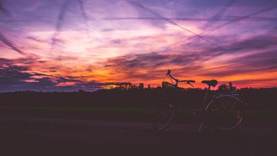 Bicycle sunset sky road 4k wallpaper