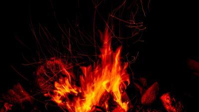 Bonfire fire sparks dark 4k wallpaper