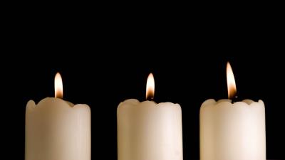 Candles lights black background three 4k wallpaper