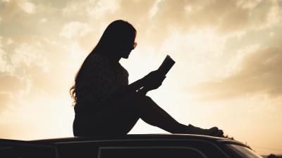 Girl reading books 4k wallpaper