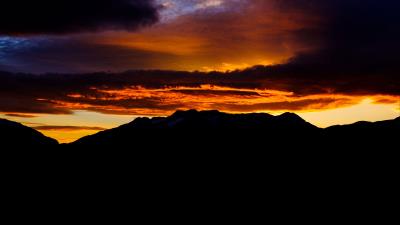 Mountains sky sunset clouds dark 4k wallpaper