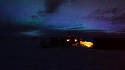 Night starry sky house light 4k wallpaper