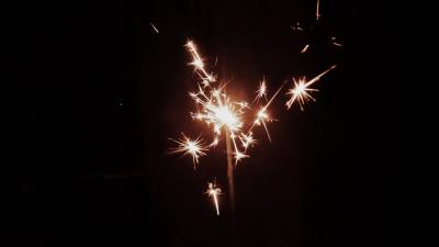 Sparkler sparks hand 4k wallpaper