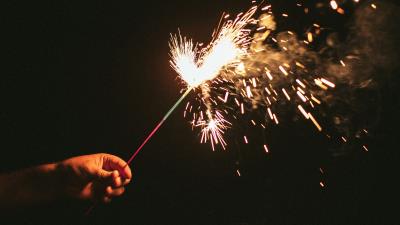 Sparklers sparks hand 4k wallpaper