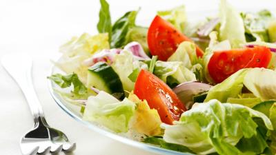 Salad plate fork close up vegetables white background 4k wallpaper