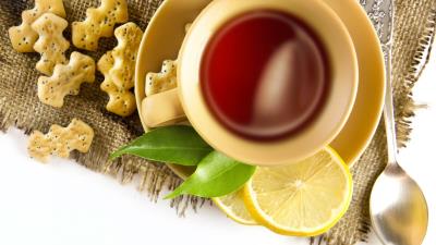 Tea cup lemon cookies spoon cloth white background 4k wallpaper