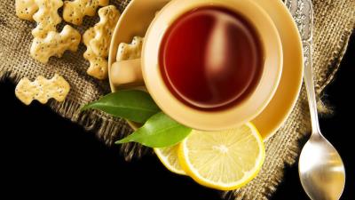 Tea lemon pastry poppy cup saucer leaves spoon black background 4k wallpaper