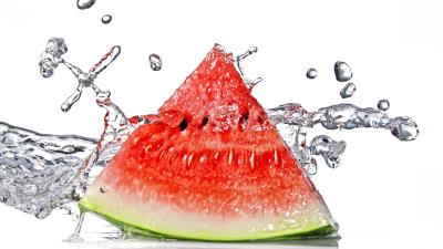 Watermelon slice piece cut water spray white background 4k wallpaper