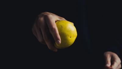 Apple hand fruit dark background 4k wallpaper