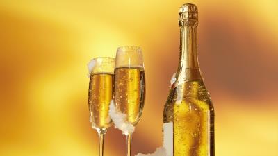 Bottle wine glasses champagne snow golden background 4k wallpaper