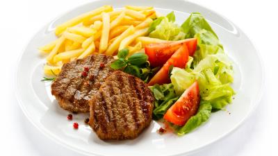 Chops meat dishes potatoes plate salad vegetables white background 4k wallpaper