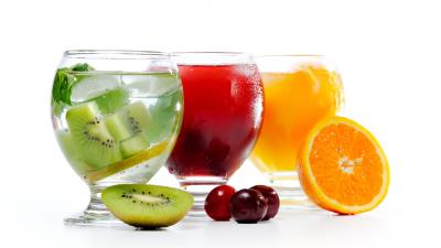 Juice three glasses kiwi cherry orange white background 4k wallpaper