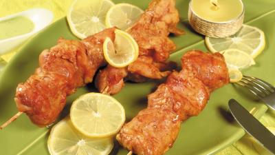 Kebabs chicken meat fork knife candles piece of plate 4k wallpaper