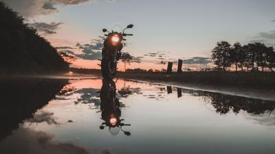 Motorcycle sunset reflection 4k wallpaper