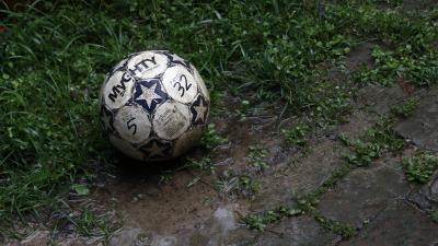 Ball football dirt grass 4k wallpaper