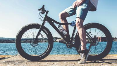 Cyclist legs bicycle river 4k wallpaper
