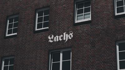 Building facade inscription 4k wallpaper