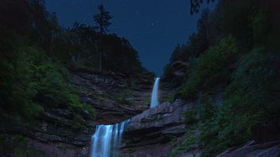 Waterfall flow starry sky 4k wallpaper