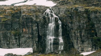 Waterfall rocks sea 4k wallpaper