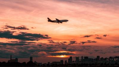 Airplane sky flight clouds sunset 4k wallpaper