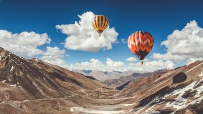 Balloons sky clouds mountains 4k wallpaper