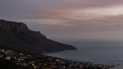 Cliff road buildings 4k wallpaper