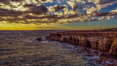 Cliff sea shore stones sky hdr 4k wallpaper