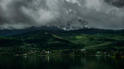 Coast mountains buildings fog 4k wallpaper