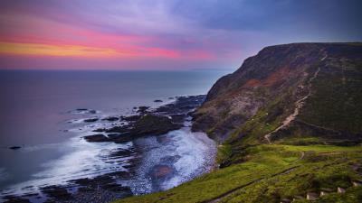 Coast sunset rocks 4k wallpaper