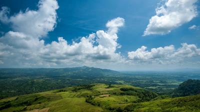 Hills distance grass 4k wallpaper