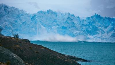 Iceberg rocks sea shore 4k wallpaper