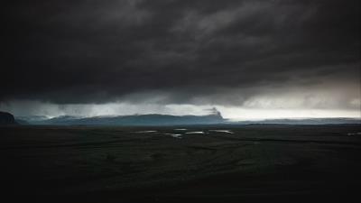 Island dark clouds 4k wallpaper
