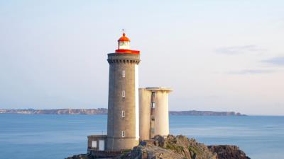 Lighthouse building rocks image 4k wallpaper