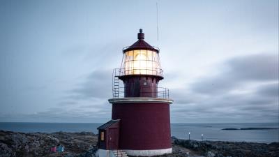 Lighthouse building rocks photo 4k wallpaper