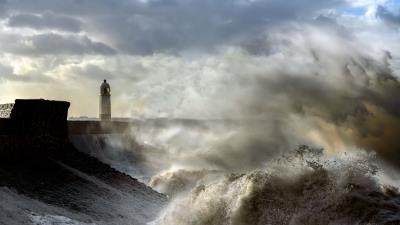 Lighthouse building waves 4k wallpaper