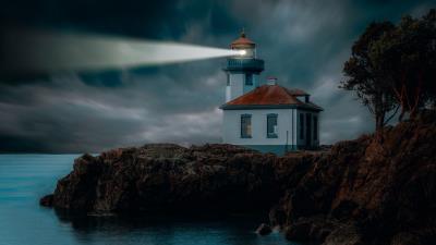 Lighthouse coast glow 4k wallpaper