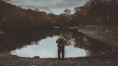 Man pond cloudy trees gloomy 4k wallpaper