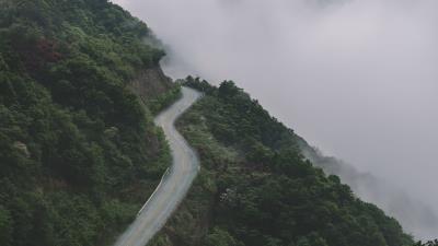 Mountains road fog 4k wallpaper
