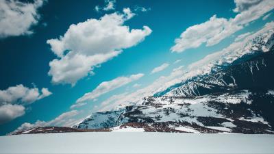 Mountains snow capped sky snow 4k wallpaper