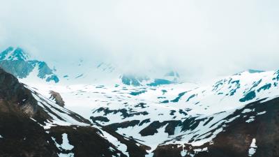 Mountains snow clouds 4k wallpaper