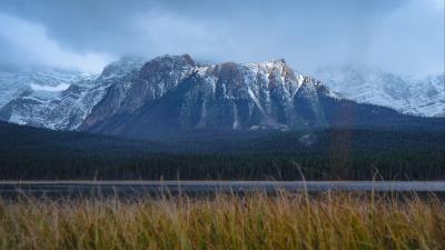 Mountains snowy grass 4k wallpaper