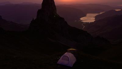 Mountains sunset tent 4k wallpaper
